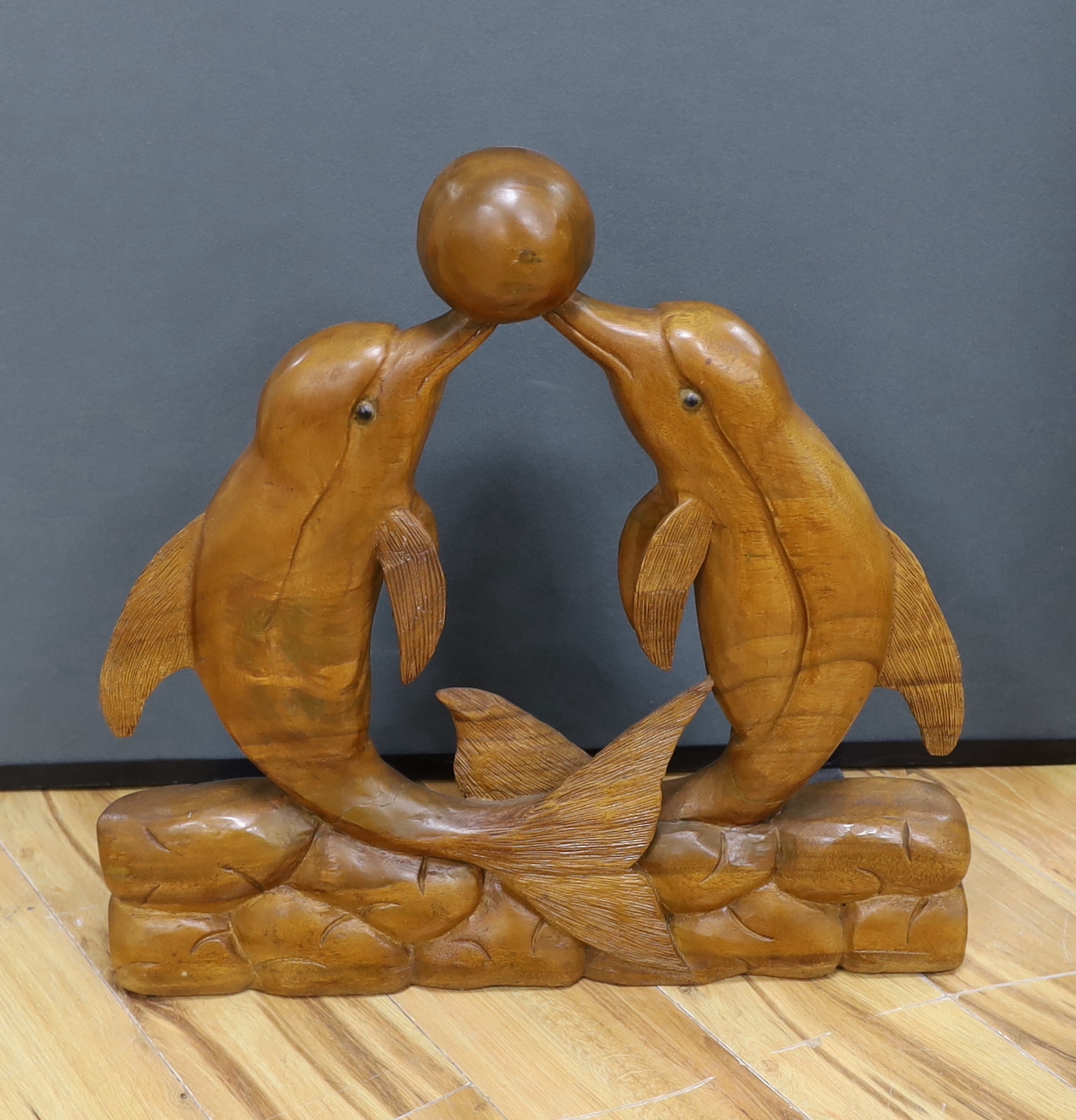 A carved dolphin group from Dolphin Square Baths, London, c.1930, 59cm